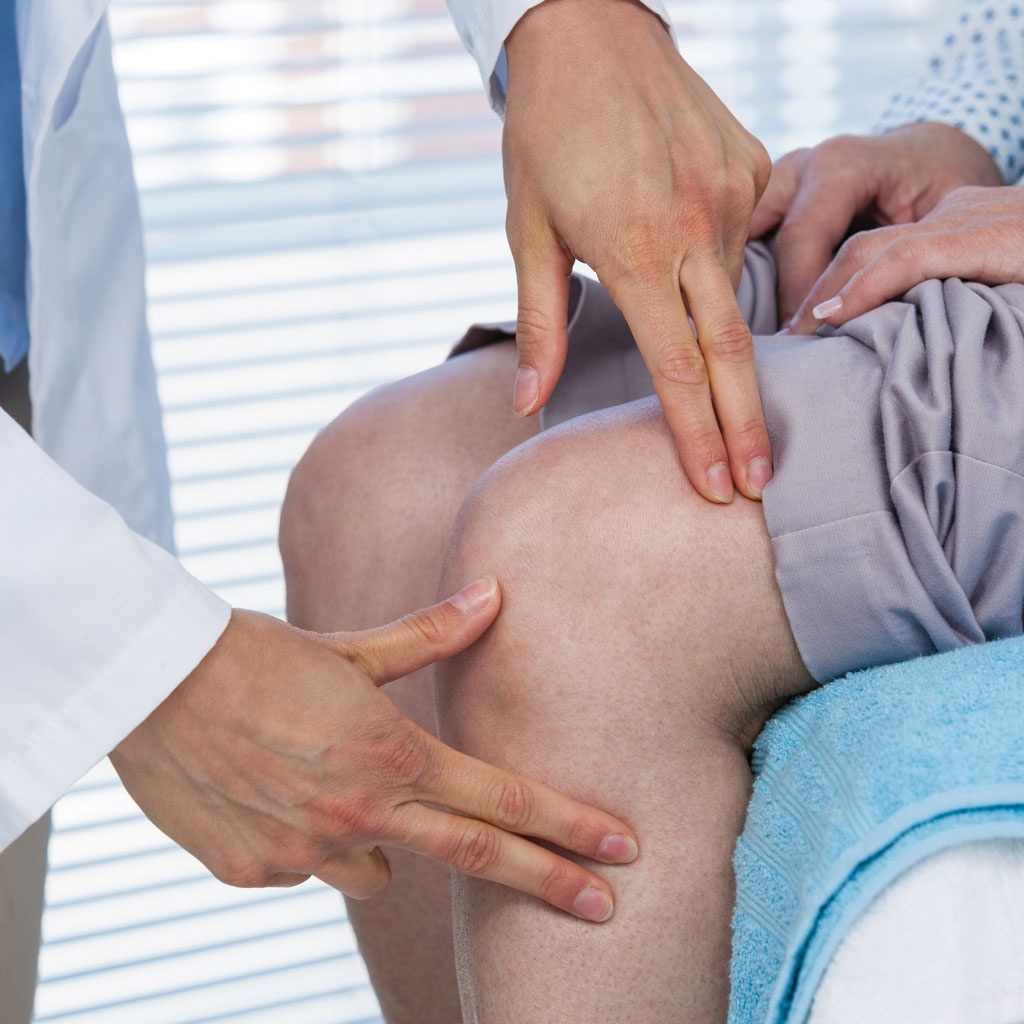 GAE Recovery Doctor Examining Knee
